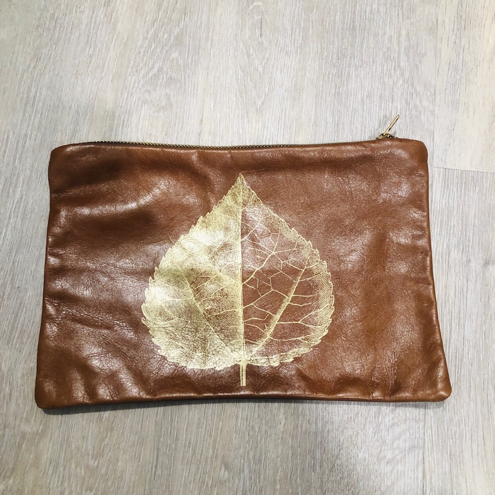Beautiful leather envelope bag with handmade stencil leaf detail